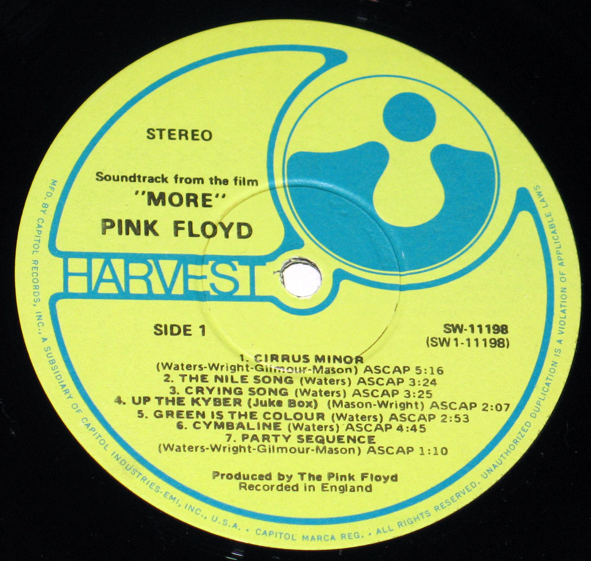 Record label for Pink Floyd’s More soundtrack album, released on Harvest Records. The label features a yellow background with a blue Harvest logo on the right. The text includes the album title, More, and band name, Pink Floyd. The catalog number SW-11198 is displayed on the right, with additional details about the production and copyright by Capitol Records and EMI.